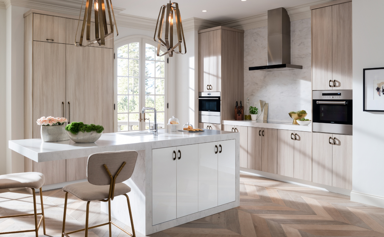 Kitchen with light wood cabinets and extended countertop
