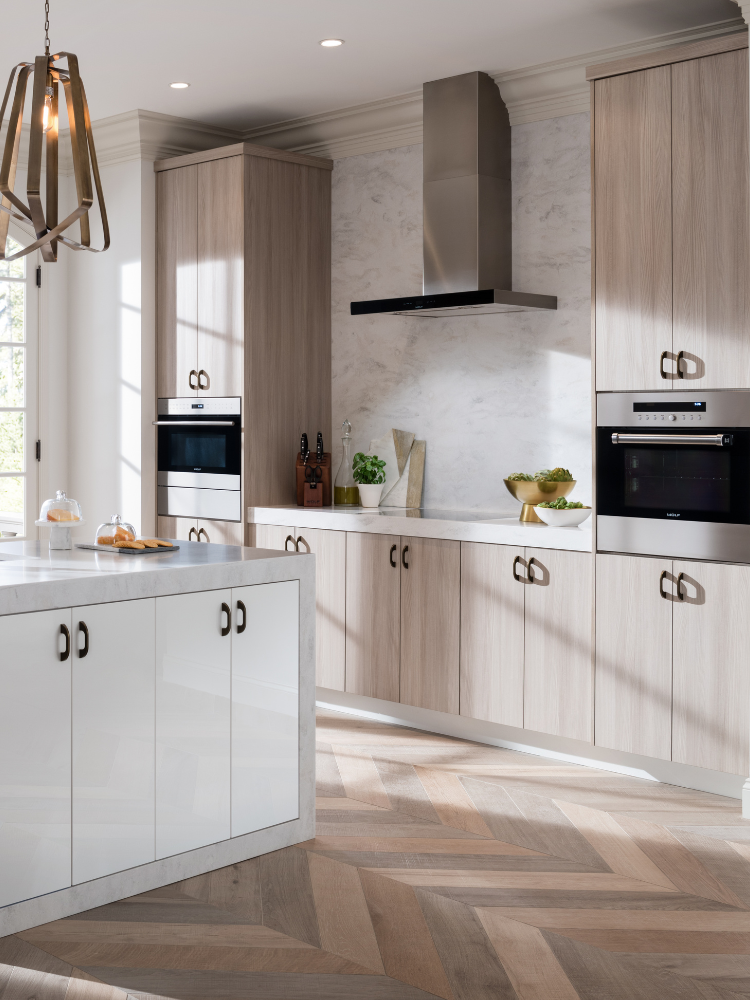 Kitchen with light wood cabinets and extended countertop